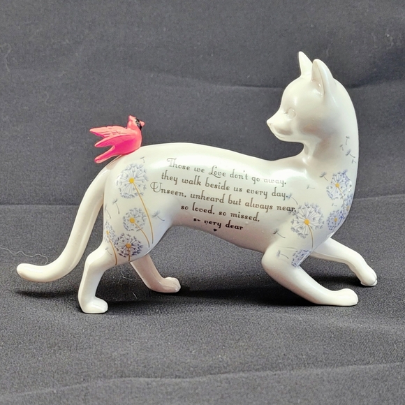 White Cat Looking Back at a Red Bird That Had Landed on His Back - Picture 10 of 12